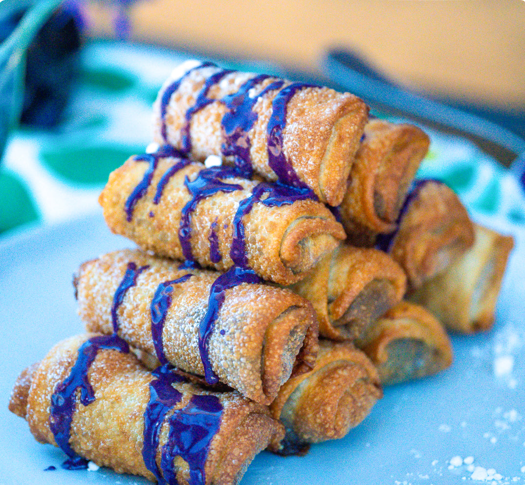 Mango Rolls with Blue Butterfly Passion Fruit Sauce